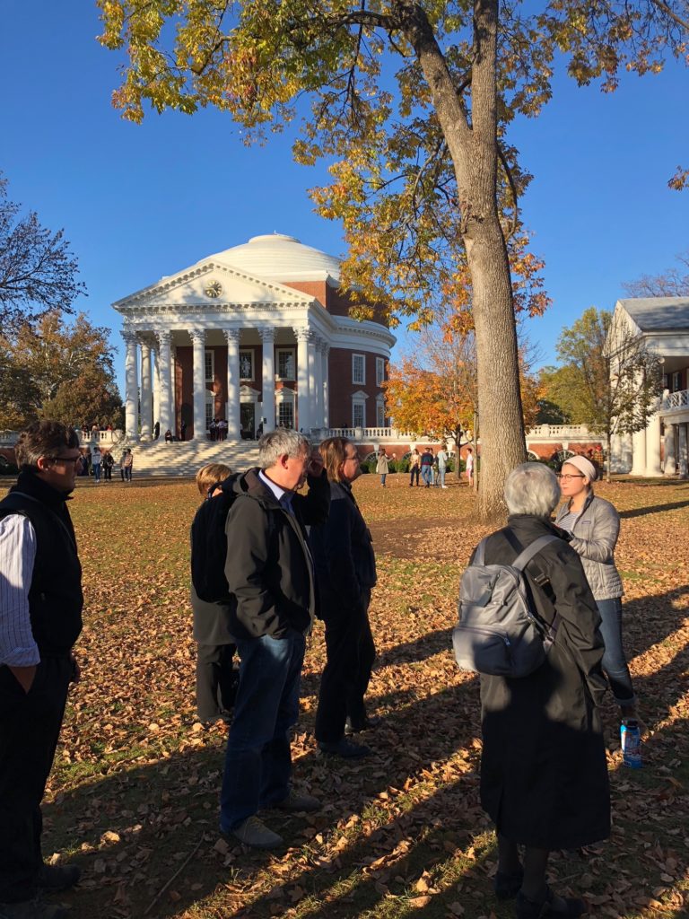 Conference attendees are milling about in front of the Rotunda.  