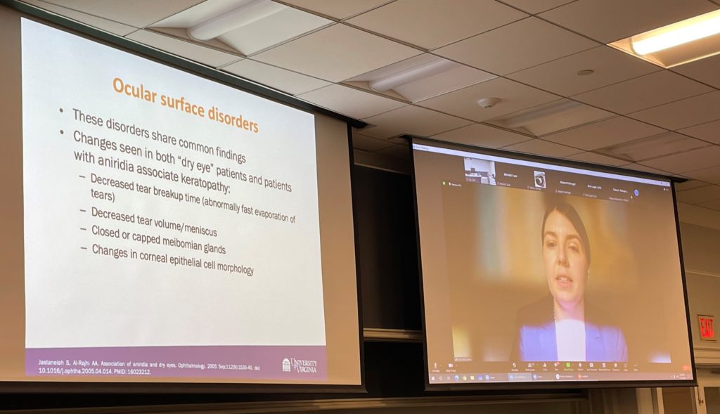Tara McGehee is shown speaking on one screen.  On the other screen, the title "Ocular surface disorders" is shown.  Under this title, text discusses changes seen in dry eye patients and in patients with AAK.   